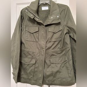 Army green utility jacket with long sleeves and drawstring waist